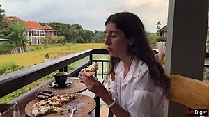 Girl with cum on face eats pizza in cafe