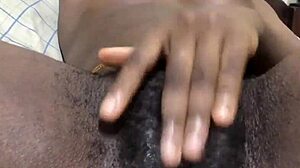 Black amateur engages in solo pussy play with masturbation, reaching wet orgasm