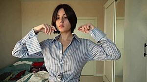 trying on new clothes like skirts, pants, tops, and blouses for a fresh look