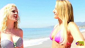 After the beach, two beautiful lesbian bimbos finger each other's shaved pussies passionately.