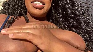 Watch this young black woman cum while masturbating her creamy pussy at home?