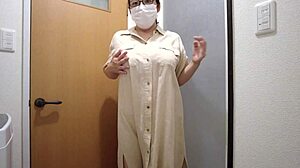 Married asian woman pleasures herself standing