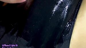 Watch me slip into this dark blue swimsuit with lotion for a slippery feel.