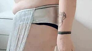 A BBW with a big ass performs an enticing belly dance on stage