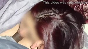 Redhead watches movies while sucking neighbor's dick
