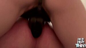 Slave takes big black dildo in anal fisting bondage