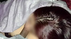 Redhead watches movies while sucking neighbor's dick