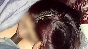 Redhead watches movies while sucking neighbor's dick