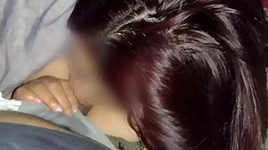 Redhead watches movies while sucking neighbor's dick