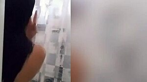 cute latina showering in the bathroom