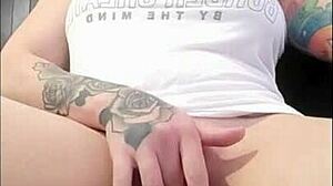 brunette rubs clit while watching porn to orgasm