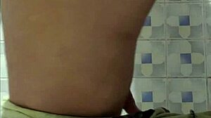Madura Flashes Big Ass in Public Bathroom Tease
