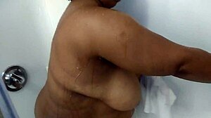 Ebony bbw with big natural tits bathes in hotel shower