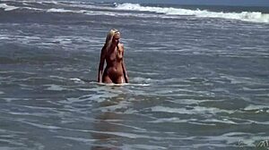 check out this gorgeous teen bathing naked in the ocean waves