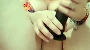 blonde mature milf fucks big pussy lips with black anal dildo