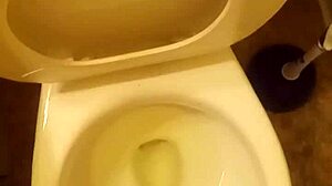 I'm the 21 year old pissing in the toilet penis peeking out