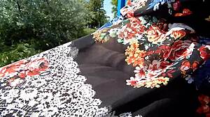 hairy mature flashes beaver through see-through dress outdoors