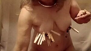 French maid slave bound bent over with nipple clamps and belt for outdoor humiliation