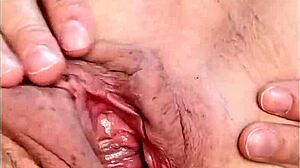 hot mature fingers her shaved pussy up close and wet