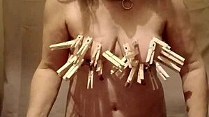 French maid slave bound bent over with nipple clamps and belt for outdoor humiliation