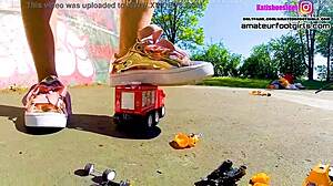 Kati the giantess crushes toy cars stomping plastic under sneakers