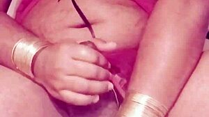 Shemale in sexy dress strokes hard cock wildly