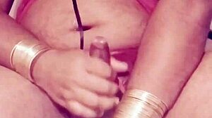 Shemale in sexy dress strokes hard cock wildly