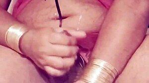 Shemale in sexy dress strokes hard cock wildly