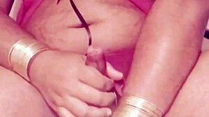 Shemale in sexy dress strokes hard cock wildly