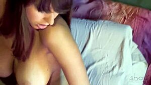 Shay Laren slowly peels off clothes in bedroom, teasing her big natural tits