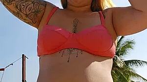 Filming beach video flashing to tease african males nearby