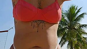 Filming beach video flashing to tease african males nearby