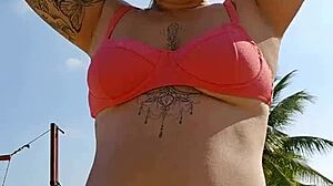 Filming beach video flashing to tease african males nearby