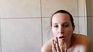 cute skinny neighbor smokes solo in homemade bathroom fetish clip
