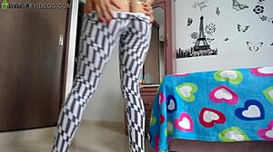 fitness model with big ass does squats in tight leggings showing off her athletic legs and natural tits