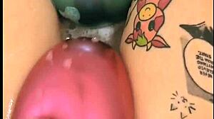tattooed girl pops balloons in bubbly bath
