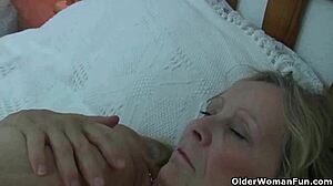 whoa, check this big-titted granny moaning as photographer fingers her wet pussy