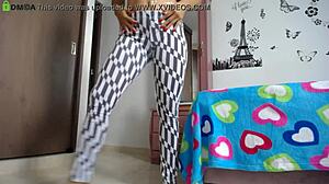 fitness model with big ass does squats in tight leggings showing off her athletic legs and natural tits