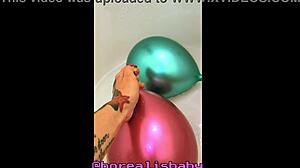 tattooed girl pops balloons in bubbly bath