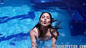 Helen Star's masked pool dive reveals wet pussy.