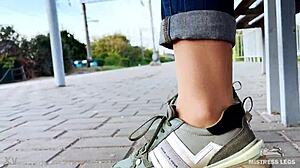 Goddess Teases Tan Nylon Soles and Legs in Blue Jeans on Outdoor Bench