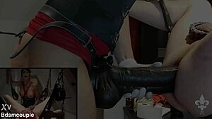 She straps on huge dildo sling fucks slave hard