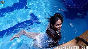 Helen Star's masked pool dive reveals wet pussy.