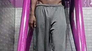 athletic brunette uses gym machine for intense solo workout