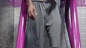 athletic brunette uses gym machine for intense solo workout