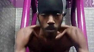 athletic brunette uses gym machine for intense solo workout