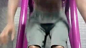 athletic brunette uses gym machine for intense solo workout