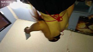 a sneaky upskirt glimpse reveals her shaved brunette babe secrets under the skirt