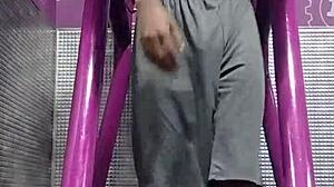 athletic brunette uses gym machine for intense solo workout