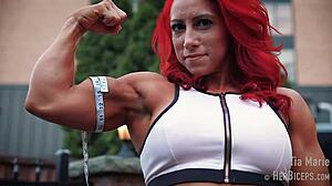 tia marie flexes her muscular biceps during measurements